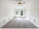 Bright, spacious living room with modern ceiling fan and natural light from two windows at 3711 Cole Mill Rd, Charlotte, NC 28270
