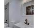 Modern bathroom with sleek finishes, shower, toilet, and sink at 4427 Gaynelle Dr, Charlotte, NC 28215