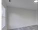Vacant room has gray floors, white walls, and a window with blinds at 4427 Gaynelle Dr, Charlotte, NC 28215