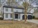 Charming two-story home featuring a black roof, white siding, and a two-car garage at 4427 Gaynelle Dr, Charlotte, NC 28215