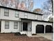 Charming two-story home featuring a black roof, white siding, and a two-car garage at 4427 Gaynelle Dr, Charlotte, NC 28215
