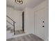 Bright foyer with modern flooring, a closet and staircase, creating an inviting entry at 4427 Gaynelle Dr, Charlotte, NC 28215