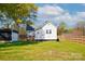 Lush backyard featuring a storage shed and wooden fence, providing ample space for outdoor enjoyment at 48 Mandalay Sw Pl, Concord, NC 28027