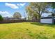 Expansive backyard with lush green grass, a storage shed, and a secure wooden fence, great for privacy at 48 Mandalay Sw Pl, Concord, NC 28027