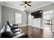 Spacious living room with hardwood floors, gray paint, and a decorative fireplace at 48 Mandalay Sw Pl, Concord, NC 28027