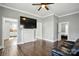 Open living room featuring hardwood floors and a non-working fireplace for an elegant touch at 48 Mandalay Sw Pl, Concord, NC 28027