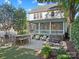 Large backyard with outdoor bar, hot tub, and screened in porch provides ample space for outdoor entertaining at 4912 Kenbury Ct, Fort Mill, SC 29708