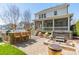 Well-maintained backyard with a stone outdoor kitchen, a hot tub, and plenty of space at 4912 Kenbury Ct, Fort Mill, SC 29708