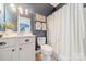 Well-lit bathroom featuring a neutral color palette and shower with curtain at 4912 Kenbury Ct, Fort Mill, SC 29708