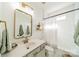 Stylish bathroom featuring tiled walls, shower, and decorative mirror at 4912 Kenbury Ct, Fort Mill, SC 29708