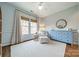 Charming bedroom with cozy armchair, area rug, and view to exterior at 4912 Kenbury Ct, Fort Mill, SC 29708