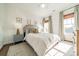 Well-lit bedroom featuring a comfortable bed, neutral decor and wood-look flooring at 4912 Kenbury Ct, Fort Mill, SC 29708