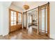 Elegant foyer with double doors, hardwood floors, and stylish lighting fixtures at 4912 Kenbury Ct, Fort Mill, SC 29708