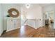 Hallway with hardwood floors, a decorative mirror, and access to other rooms at 4912 Kenbury Ct, Fort Mill, SC 29708
