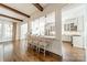 Open kitchen with bar seating, pendant lights, and a view into the living room at 4912 Kenbury Ct, Fort Mill, SC 29708