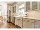 Bright kitchen features farmhouse sink, stainless steel appliances, and marble countertops at 4912 Kenbury Ct, Fort Mill, SC 29708