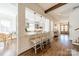 Well-appointed kitchen featuring bar seating, pendant lights, and hardwood floors at 4912 Kenbury Ct, Fort Mill, SC 29708