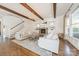 Comfortable living room with wood beams, a stone fireplace, and staircase at 4912 Kenbury Ct, Fort Mill, SC 29708