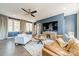 Spacious living room with hardwood floors, comfortable sofas and flat screen television at 4912 Kenbury Ct, Fort Mill, SC 29708