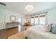 Bright main bedroom with hardwood floors, natural light, and a sitting area at 4912 Kenbury Ct, Fort Mill, SC 29708