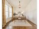 Bright office space with large windows, hardwood floors, and a modern chandelier at 4912 Kenbury Ct, Fort Mill, SC 29708