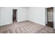Spacious bedroom with neutral carpet and open doorways at 502 Maddox Dr, Shelby, NC 28152