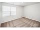 Bright bedroom with a large window and neutral carpet at 502 Maddox Dr, Shelby, NC 28152