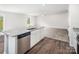 Open kitchen with granite countertops, stainless steel dishwasher, and a view to the living room at 502 Maddox Dr, Shelby, NC 28152