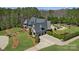 Aerial view of a house with a pool, landscaped grounds, and a circular driveway at 525 Lake Lynn Rd, Concord, NC 28025