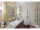 Charming bathroom features a single vanity, a framed mirror, and a glass-enclosed shower at 525 Lake Lynn Rd, Concord, NC 28025