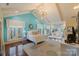 Well-lit bedroom features a vaulted ceiling, wood floors, and access to a living room at 525 Lake Lynn Rd, Concord, NC 28025
