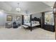 Expansive main bedroom suite boasts a tray ceiling, sitting area, and plush carpeting at 525 Lake Lynn Rd, Concord, NC 28025