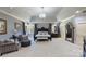 Spacious bedroom with a sitting area, stylish decor, and a view of an en-suite bathroom at 525 Lake Lynn Rd, Concord, NC 28025