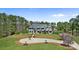 Aerial view of the estate, showcasing its circular driveway, lush lawn, and manicured landscaping at 525 Lake Lynn Rd, Concord, NC 28025