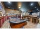 Finished basement features a game room with a wet bar and a roulette table for entertainment at 525 Lake Lynn Rd, Concord, NC 28025