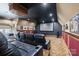 Home theater room with tiered seating, a large projection screen, and cozy carpet at 525 Lake Lynn Rd, Concord, NC 28025