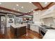 An open kitchen with stainless steel appliances, a granite island and hardwood floors at 525 Lake Lynn Rd, Concord, NC 28025