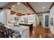Bright, white kitchen with granite countertops, stainless steel appliances and a wooden floor at 525 Lake Lynn Rd, Concord, NC 28025
