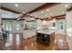 Expansive kitchen featuring a large island, wood beams and flooring, and modern cabinetry at 525 Lake Lynn Rd, Concord, NC 28025