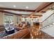 Inviting living area seamlessly connects to kitchen and staircase, featuring hardwood floors and comfortable seating at 525 Lake Lynn Rd, Concord, NC 28025