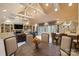 Large entertainment room with a bar, dining table, fireplace and comfortable seating at 525 Lake Lynn Rd, Concord, NC 28025