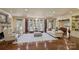 Spacious living room with fireplace, hardwood floors, and large windows offering ample natural light at 525 Lake Lynn Rd, Concord, NC 28025