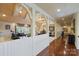 A living room with arched doorways, wood floors and adjacent sitting area at 525 Lake Lynn Rd, Concord, NC 28025