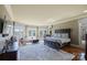 Spacious primary bedroom with sitting area, large windows and luxurious finishes at 525 Lake Lynn Rd, Concord, NC 28025