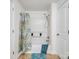 This bathroom includes a shower with a curtain and a blue towel at 703 Rankin Ave, Mount Holly, NC 28120