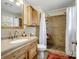 Bathroom features updated vanity and tile shower, creating a functional and comfortable space at 703 Rankin Ave, Mount Holly, NC 28120