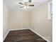 Neutral room features wood-look flooring and a ceiling fan to keep the space flexible for various design options at 703 Rankin Ave, Mount Holly, NC 28120