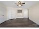 Bedroom with ceiling fan, neutral paint, and closet space providing ample storage at 703 Rankin Ave, Mount Holly, NC 28120