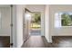 Bright entryway with a stylish front door, new flooring, and plenty of natural light at 703 Rankin Ave, Mount Holly, NC 28120