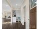 Inviting foyer features modern floors, built-in storage, and charming decor at 703 Rankin Ave, Mount Holly, NC 28120